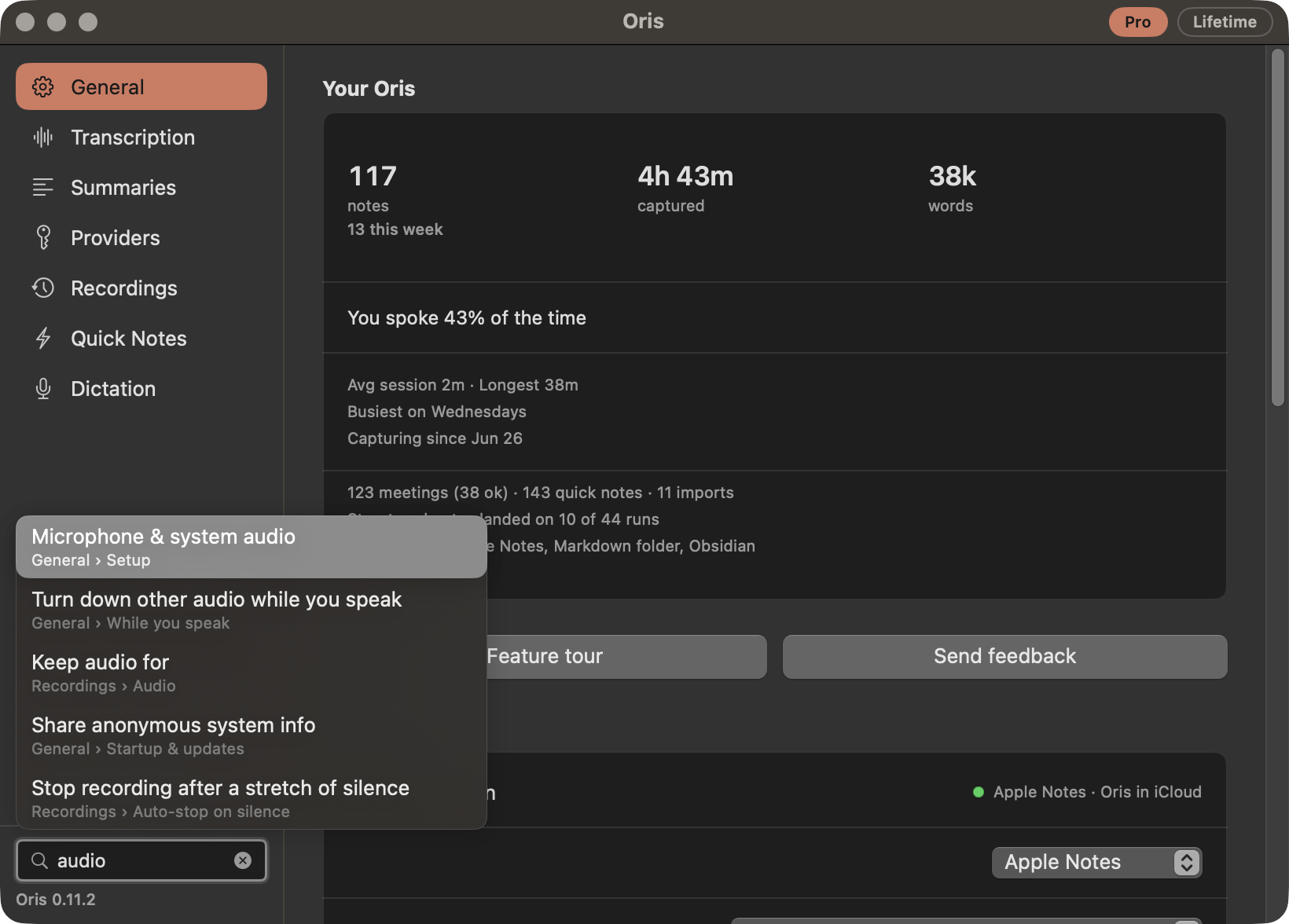 The Oris settings window in dark mode with 'audio' typed into the search field in the rail's footer. Five results open upward from the field, each showing a control's label above the section and group it lives in: 'Microphone & system audio / General › Setup' highlighted, 'Turn down other audio while you speak / General › While you speak', 'Keep audio for / Recordings › Audio', 'Share anonymous system info / General › Startup & updates', and 'Stop recording after a stretch of silence / Recordings › Auto-stop on silence'.